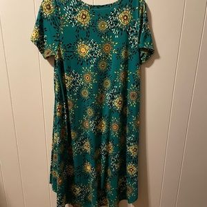Print flowing dress. Longer in the back.  Runs big.
